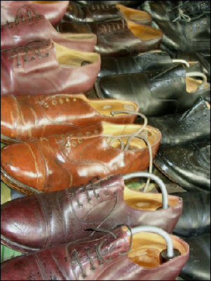 Stall in Portobello market selling second-hand shoes