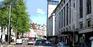 View down Kensington High Street in London with the famous Barkers building