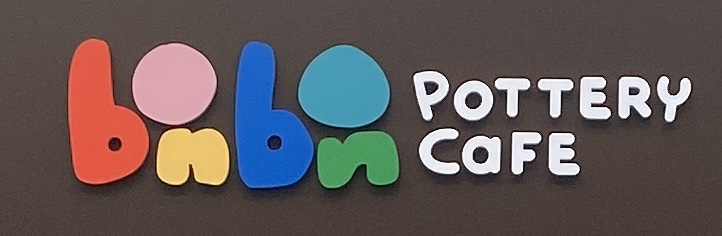 Sign at Bon Bon pottery cafe on Westbourne Grove in London