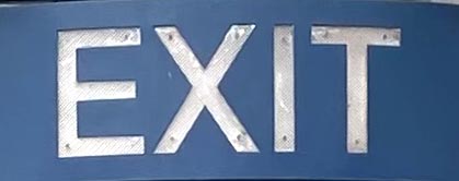 Sign at Exit bar on Brick Lane in London