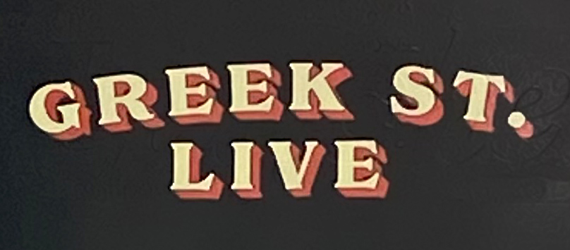 Sign at Greek Street Live bar in London's Soho
