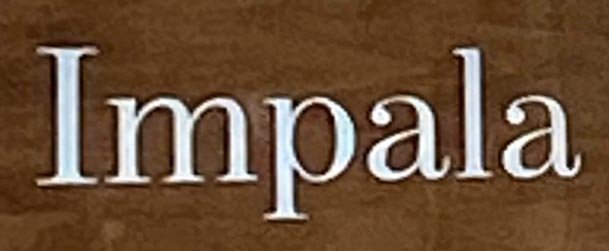 Sign at Impala restaurant on Dean Street in London