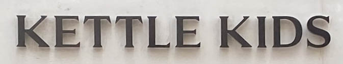 Sign at Kettle Kids shop on Old Bond Street in London