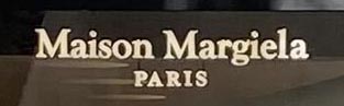 Sign at Maison Margiela shop on Bruton Street in London's Mayfair