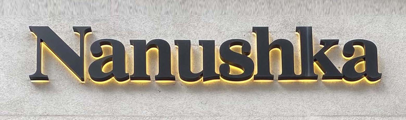 Sign at Nanushka shop on Bruton Street in London's Mayfair