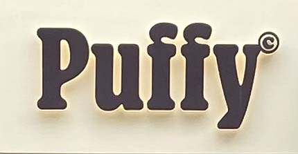 Sign at Puffy bakery on Old Compton Street in London's Soho