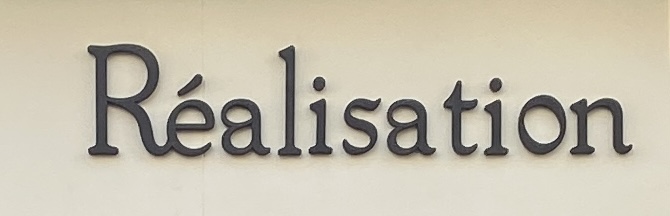 Sign at Realisation shop on Motcomb Street in London