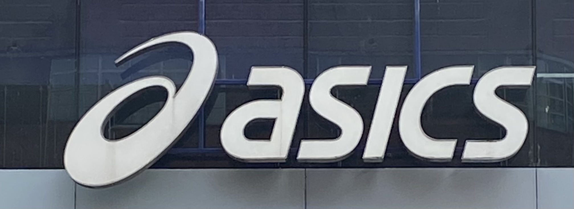 Sign at Asics sportswear shop on Oxford Street