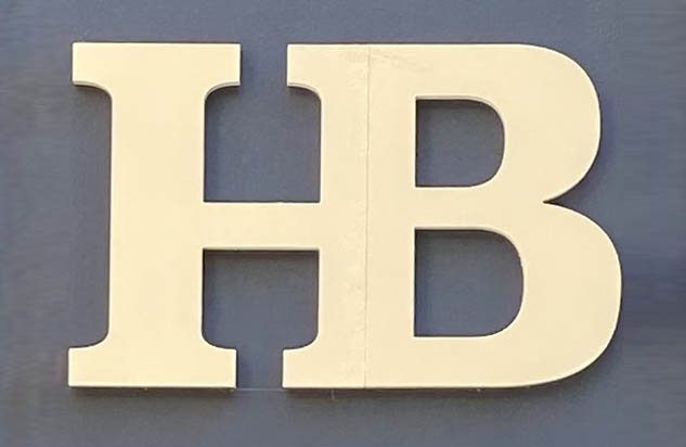 Sign at Hampstead Bazaar womenswear shop on Gees Court in London