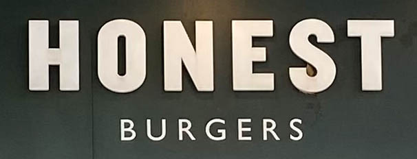 Sign at Honest Burgers restaurant on Tottenham Court Road