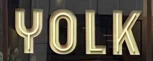 Sign at Yolk on the Strand in London's Covent Garden