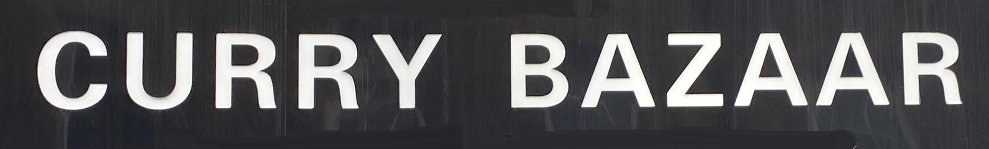 Sign at Famous Curry Bazaar restaurant on Brick Lane in London