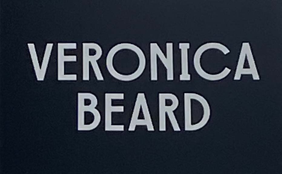 Sign at Veronica Beard womenswear shop on Bruton Street in London's Mayfair