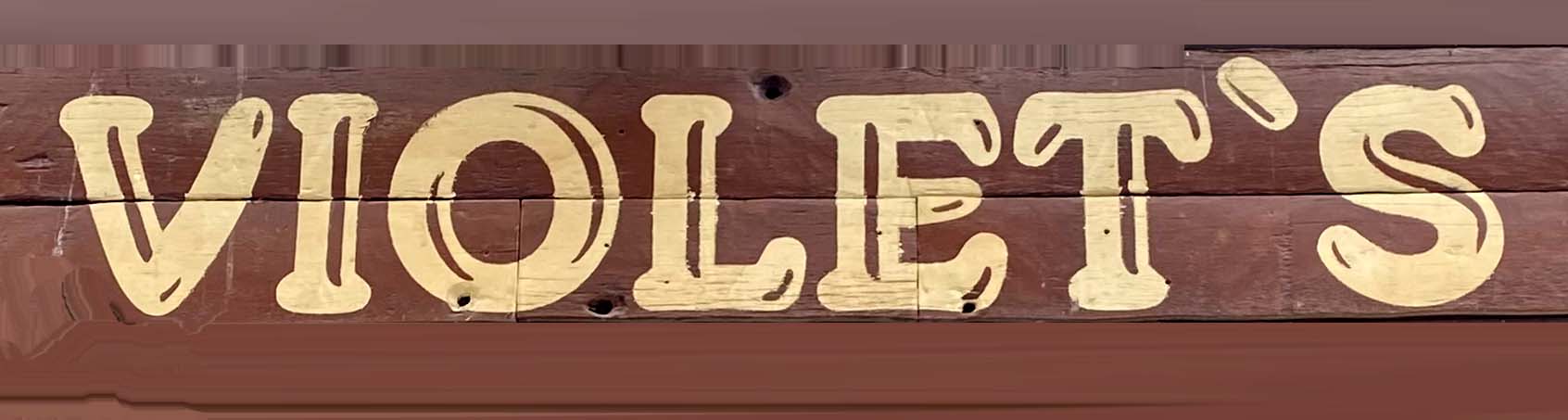Sign at Violet's bar on Berwick Street in London's Soho