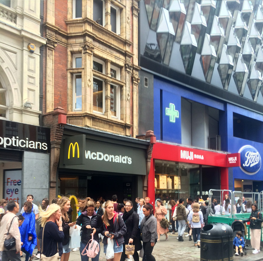 Shoppers on London's Oxford Street outside McDonalds