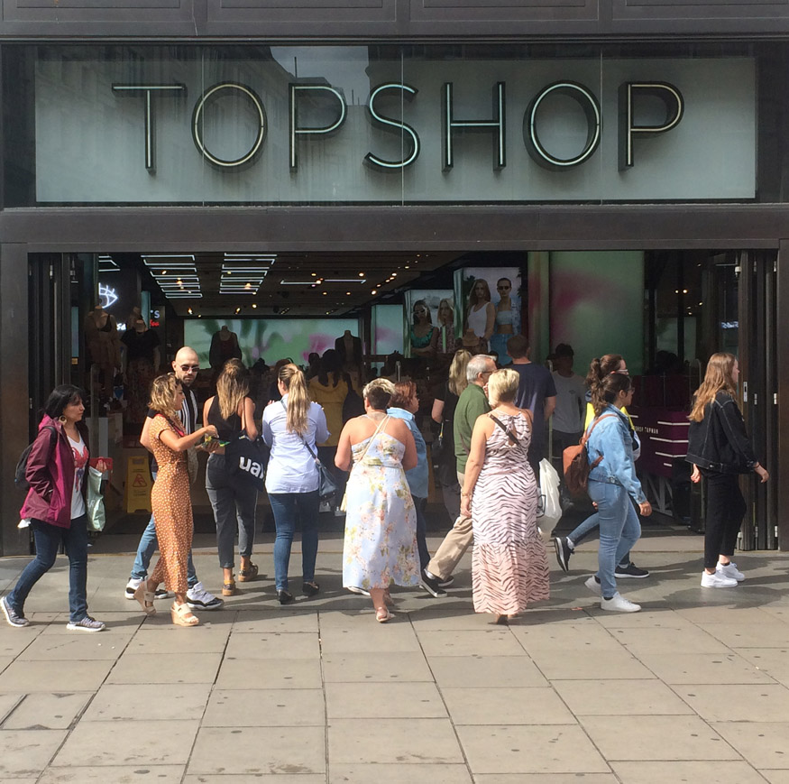 Shoppers outside Topshop fasion store at London's Oxford Circus