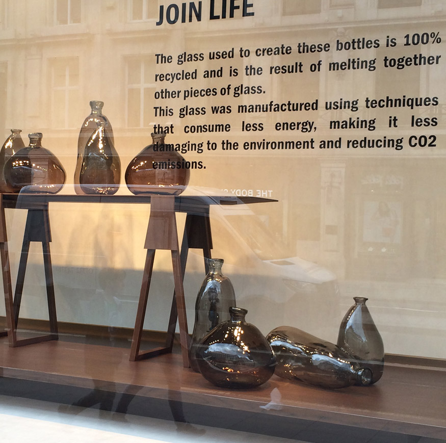 Window display of recycled glass bottles